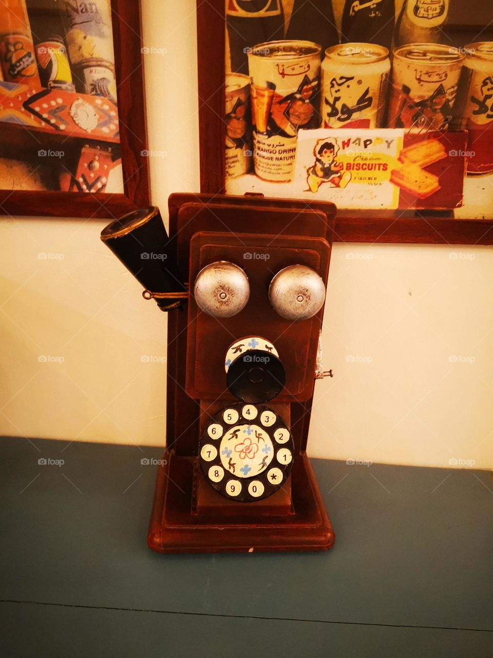 An old phone that is placed on the tables for decoration