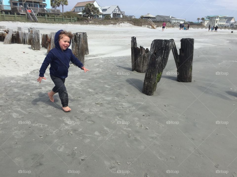 Child running on the beach.