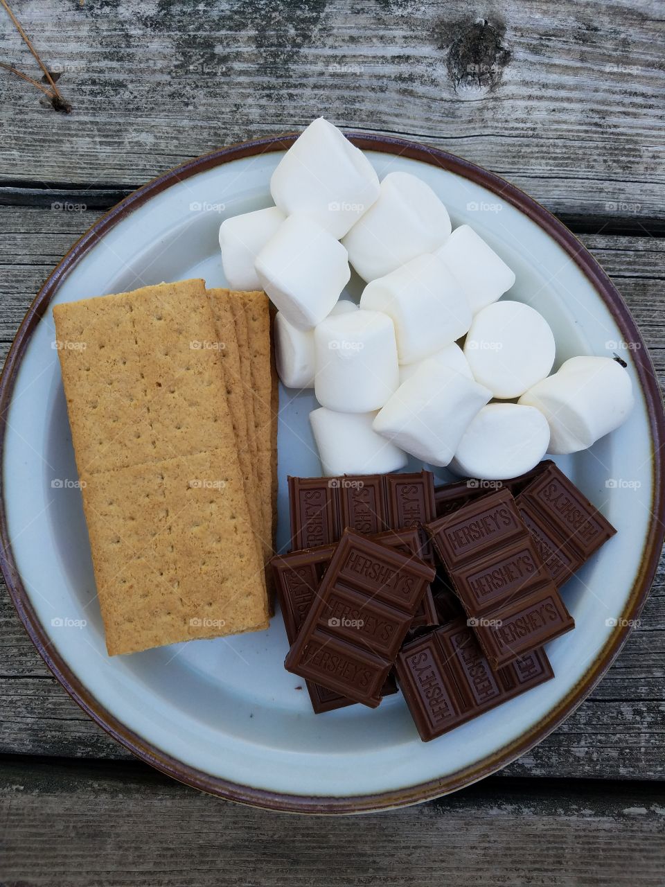 High angle view of marshmallows and chocolate in plate
