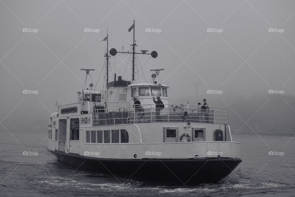 Ferry to Suomenlinna fortress island approaching Kauppatori market place in thick fog in Helsinki, Finland on 11 September 2014.