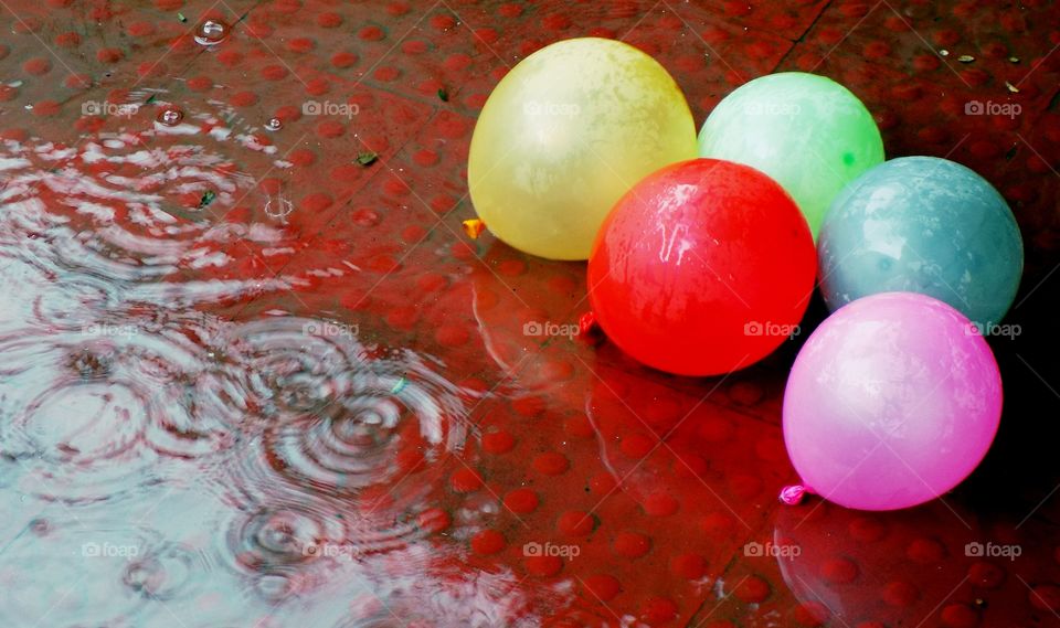 Colourful balloon in rain