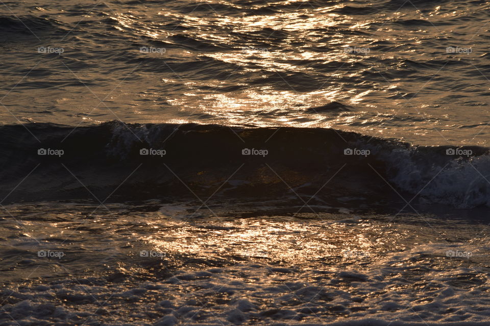 sea waves when sunset