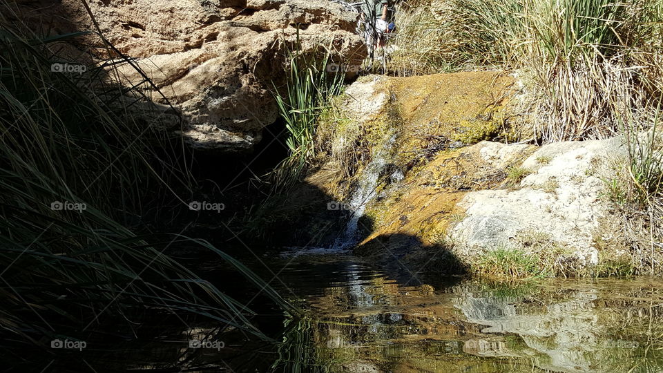 mountain pond and waterfall