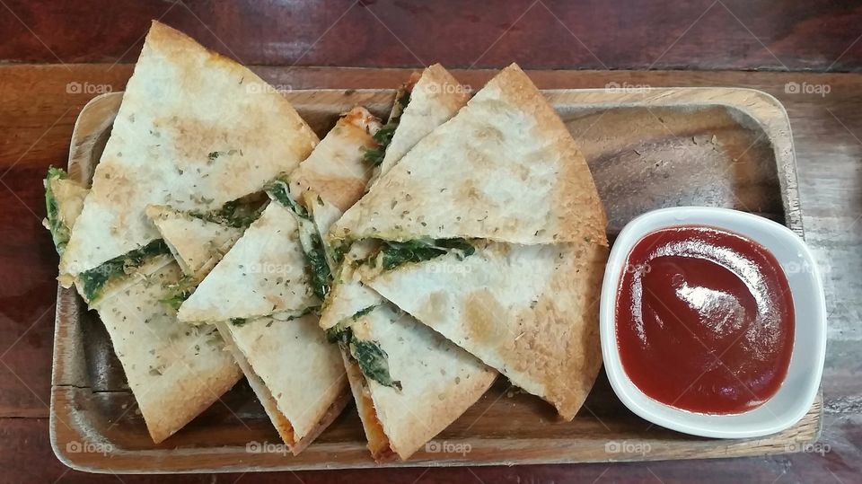 one more bite of mexican food in Thailand calls tortilla with spinish and cheese