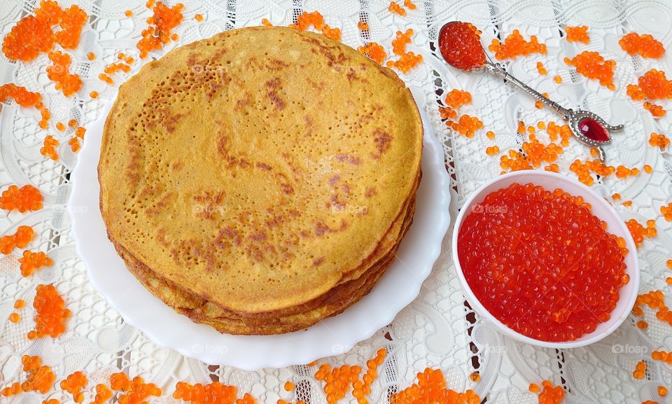 Pancakes with red caviar are a Russian tradition