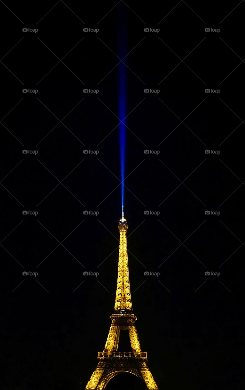 The iconic Eiffel Tower in contrast with the dark night