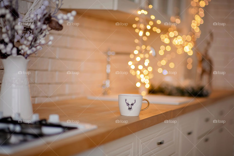 cup of coffee in a cozy festive Christmas atmosphere