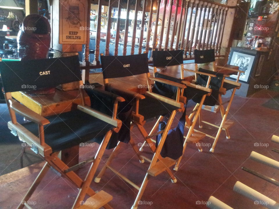 cast seats at a film set. cast seats seup prior to a filming at a local bar.
