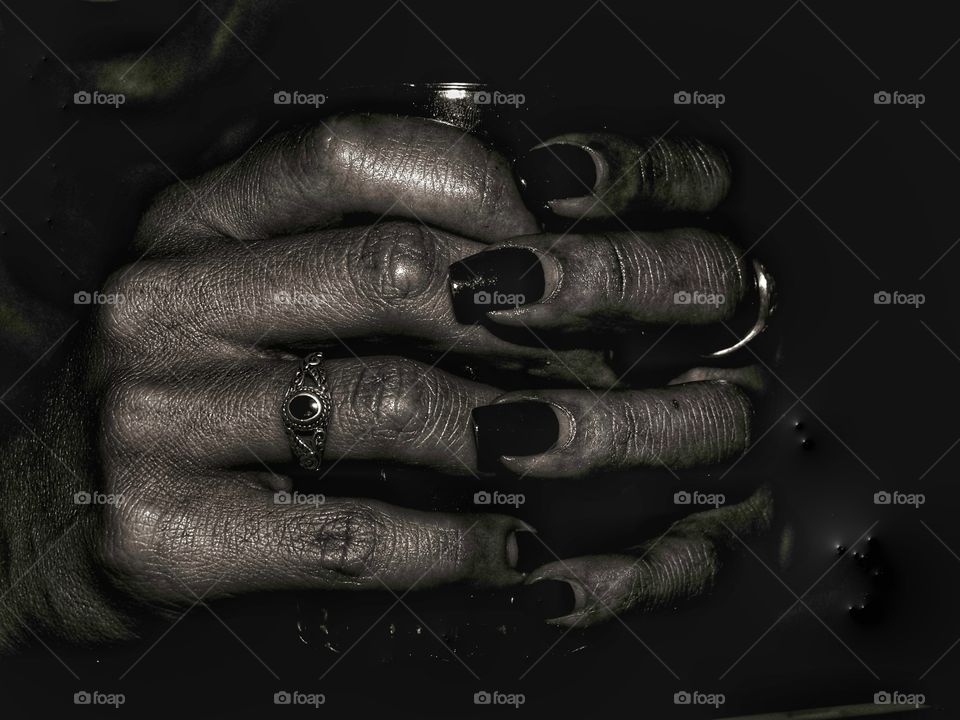 an older woman hands after finishing her daily job in the making of argan oil .