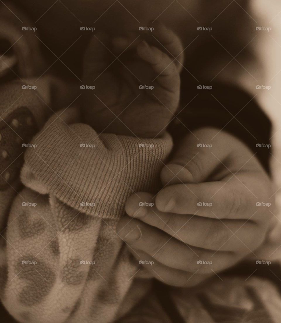 Brother and sister hands . My son meeting his sister at the hospital for the first time 