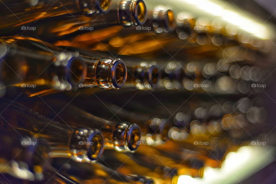 Empty glass bottles arranged in row