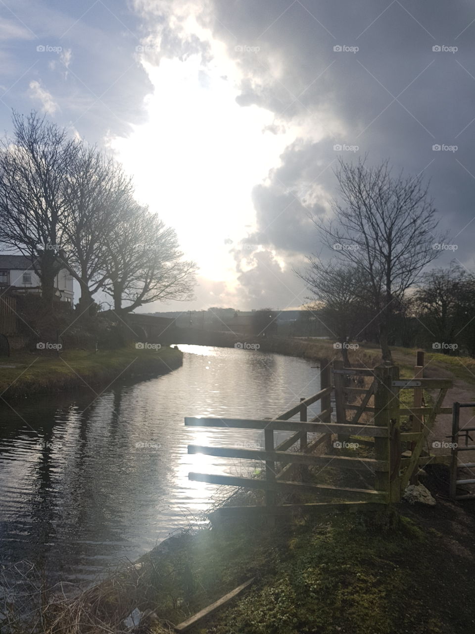 Sun In The Clouds On Canal Path