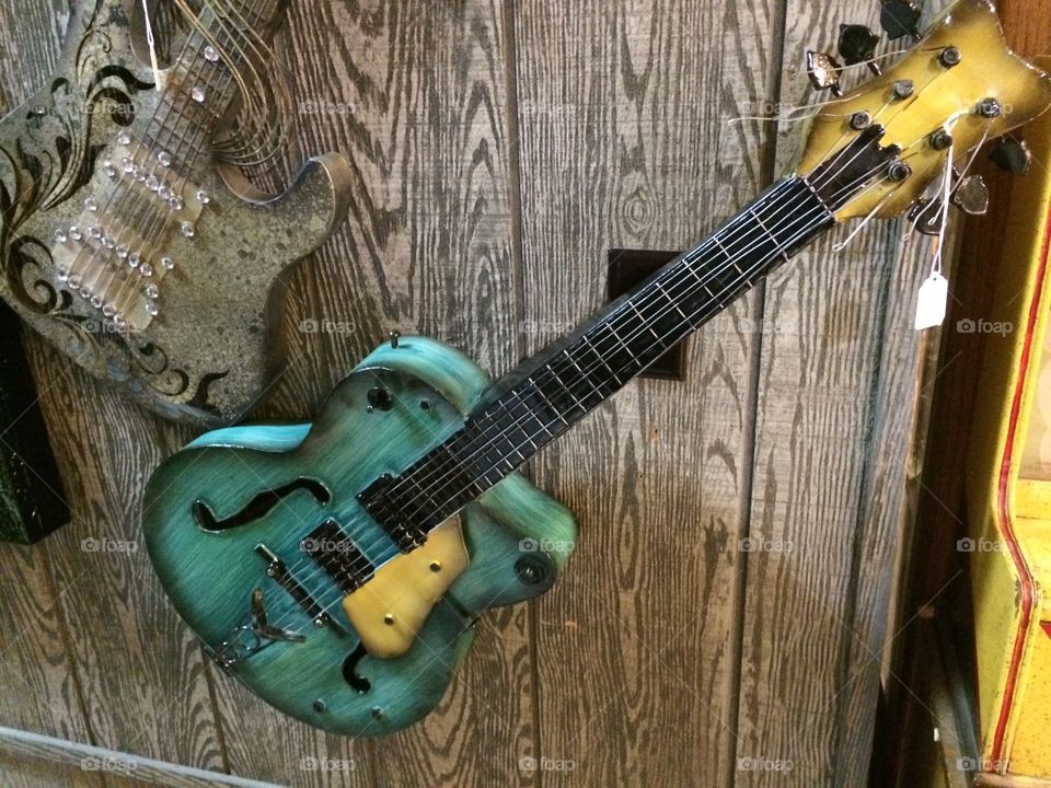 Electric guitar on wooden background
