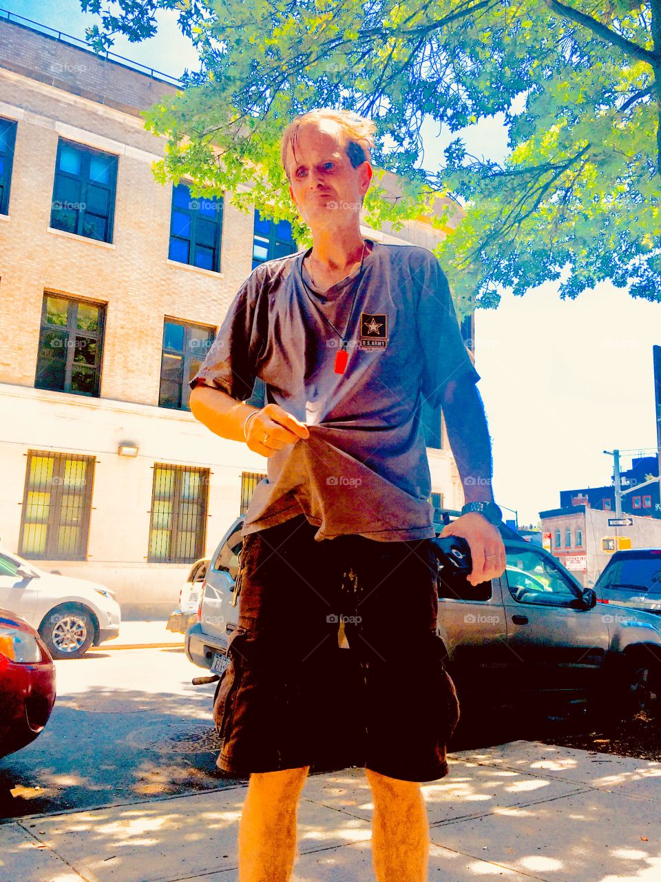 My friend and partner in life Timothy wringing out his shirt because it’s just sooo damned hot on this bright sunshiny afternoon on Waverly Street in Brooklyn, New York. This picture was taken in the summer of 2020. Hypnotic Productions