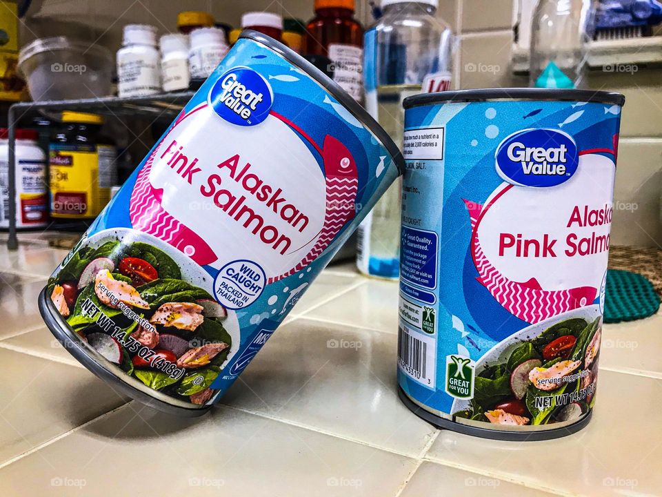 A pair of canned salmons ready for consumption. No cooking is required.