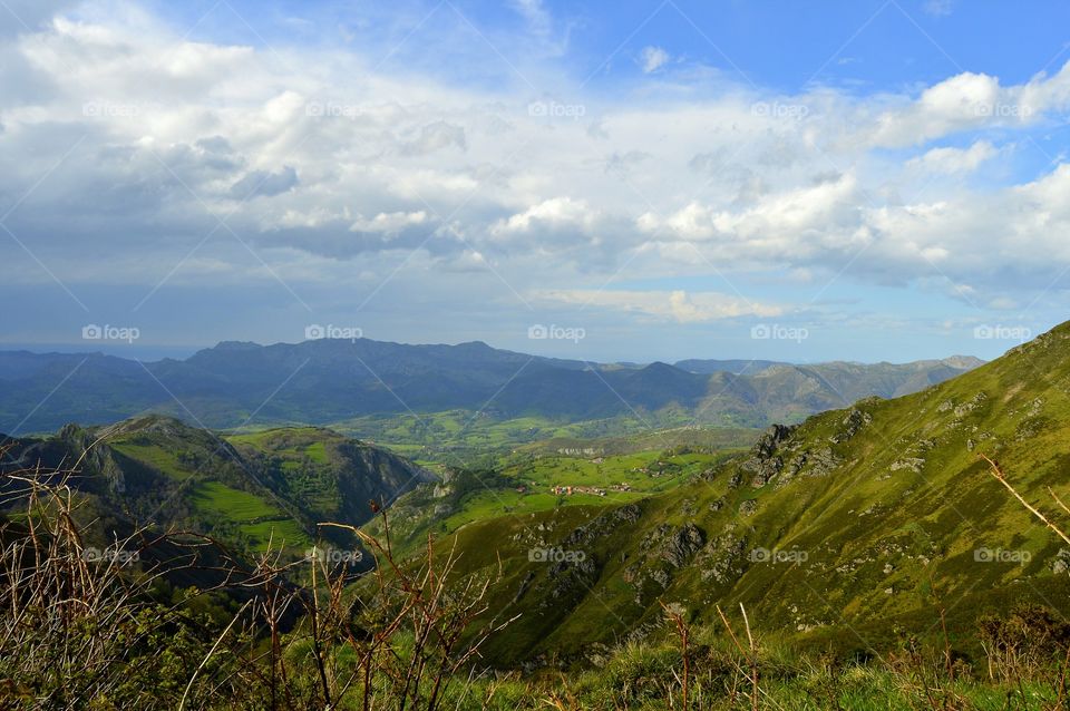 Green nature, mountains and a little village. An Asturias landscape.
