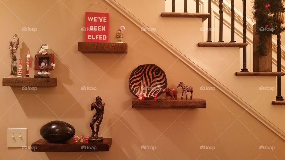 Floating Shelves with Christmas and Fall Decor at Side of Flight of Stairs