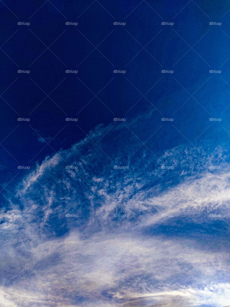 I want to show white clouds and blue sky in this photo.  The sky looks very beautiful with clouds and blue sky.