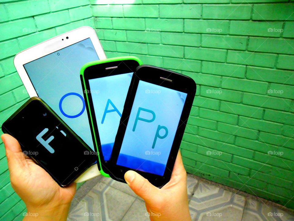 different mobile gadget with letters spelling the word foap