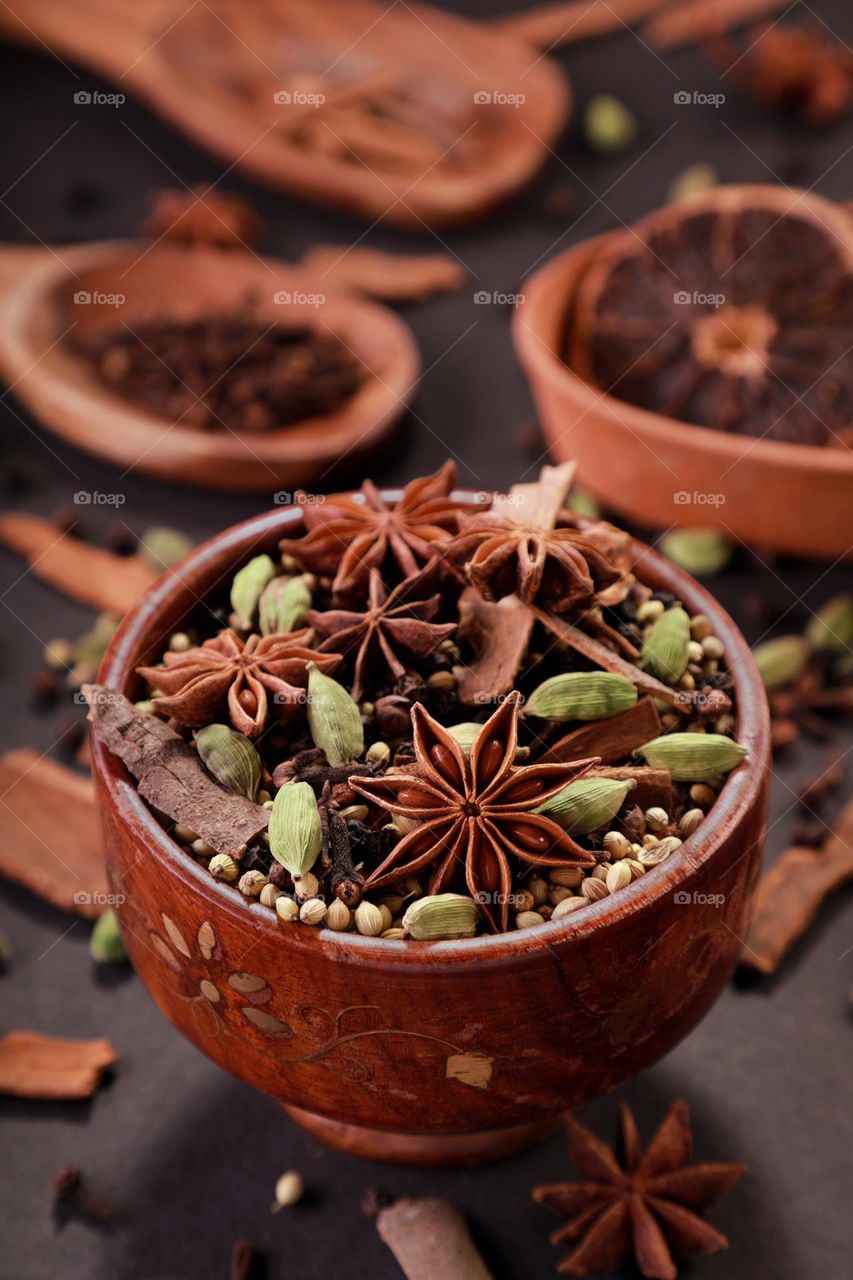 Fresh Indian spices in a wooden bowl