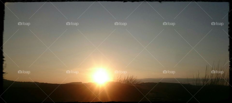 the sun over hills in Jedburgh