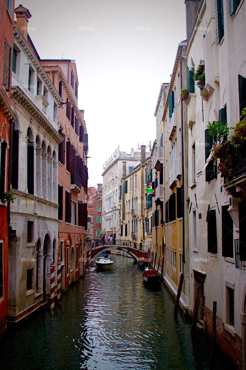 Canal through buildings in Venice