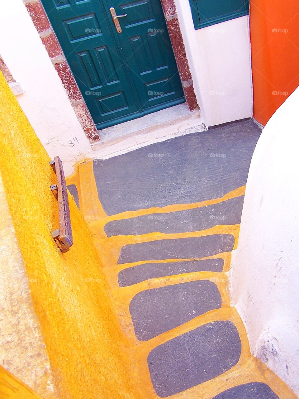 Steps descending to a home in the village of Oia on the island of Santorini in Greece