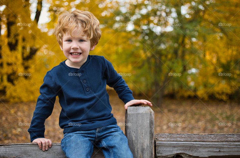 Boy on fence. 