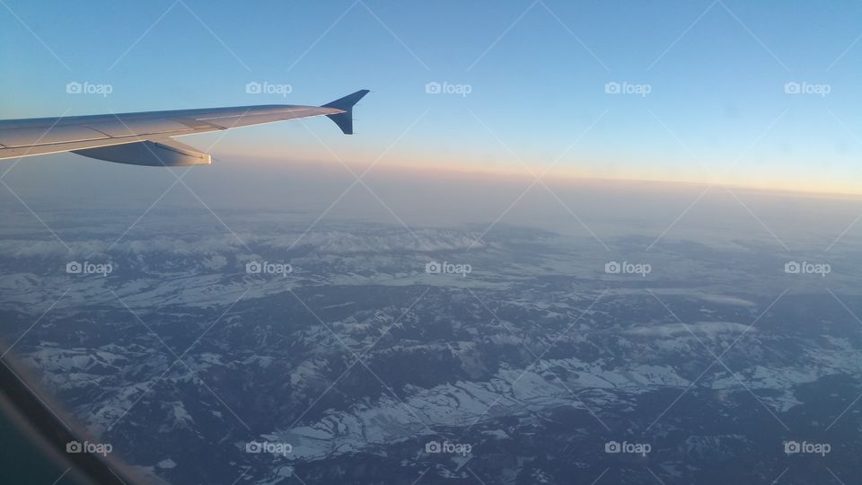 Plane view, clouds in the sky and mountains