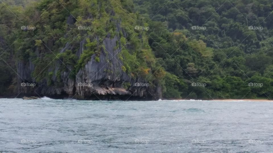 Worn down cliff at the edge of the ocean in the Phillipine Islands
