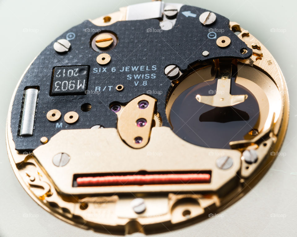 Macro shot of a Swiss made quartz watch movement