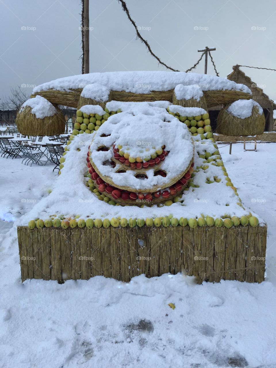 In case you have lost your mobile phone - don't worry, there is a substitute 😊 Huge telephone made of straw, Apples and snow - seen on our winter walk in Rapperswil, Switzerland.