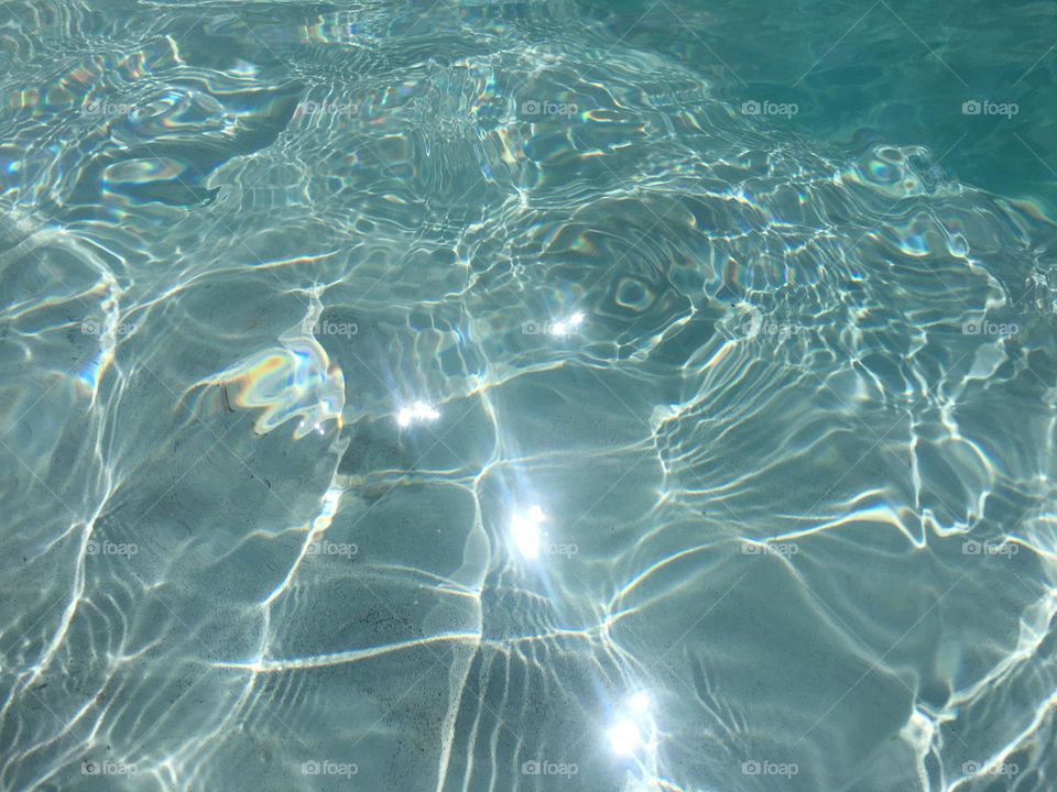 Bright clear water on a sunny morning with ripples