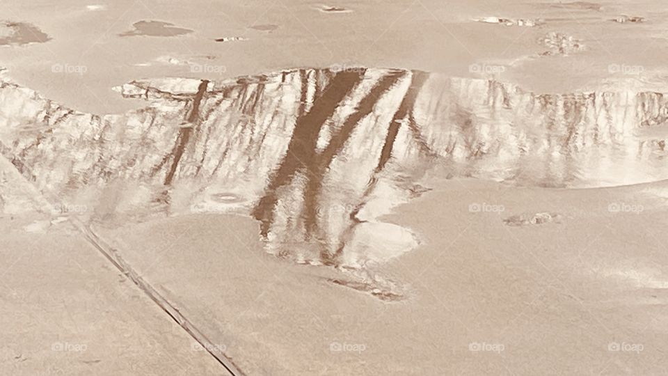 Rain Go Away After You make us new Puddle of Reflections From Neighboring Lakebed Trees Leafless. Rain Drops Abstracting our Puddle of Reflections.