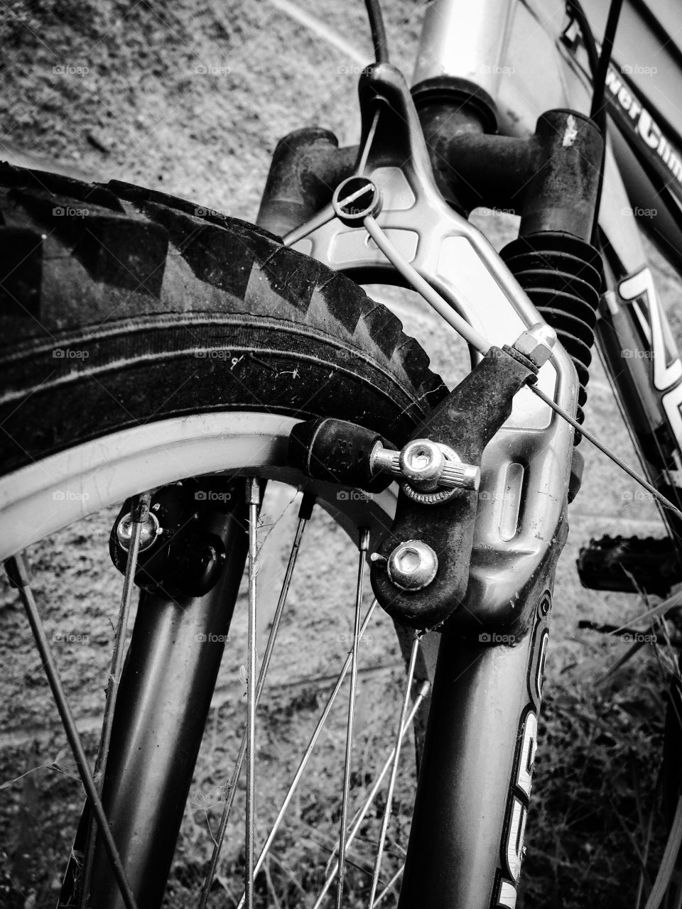 Close up of brakes on bicycle in black-and-white