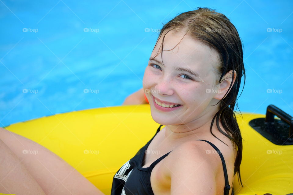 Girl relaxing in a pool