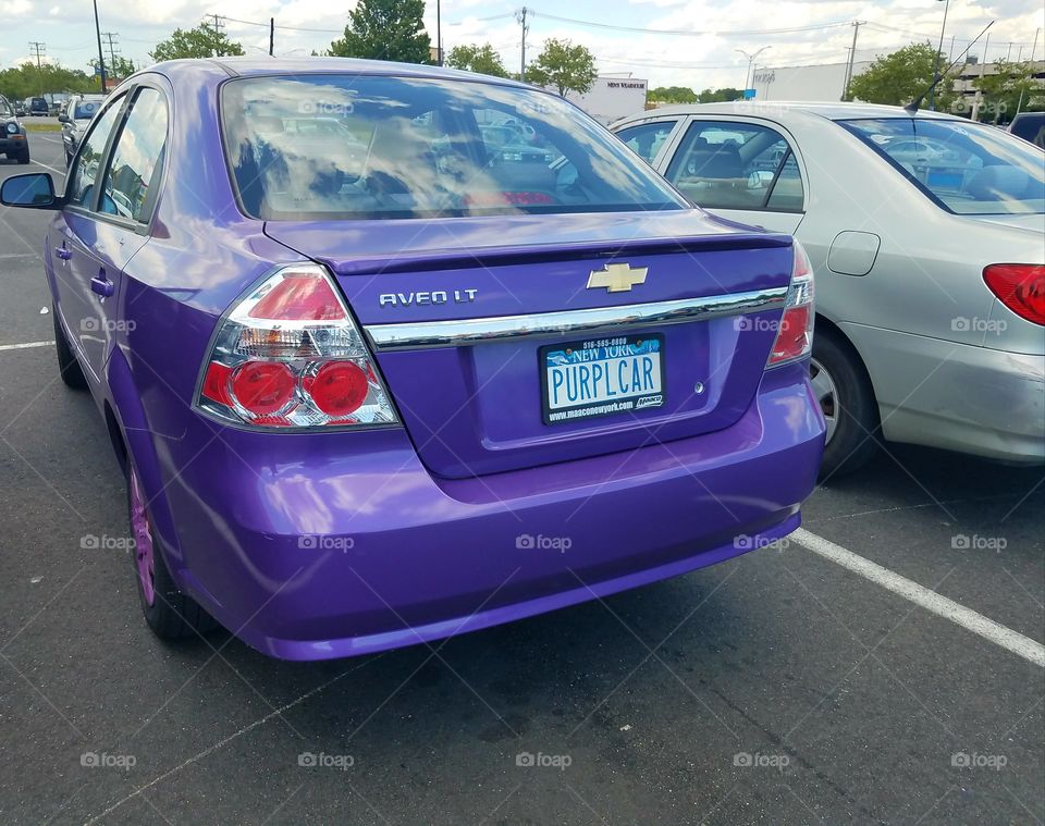 purple car purple inside ans out purple eyelashes. Owner is an elderly woman in her 80s