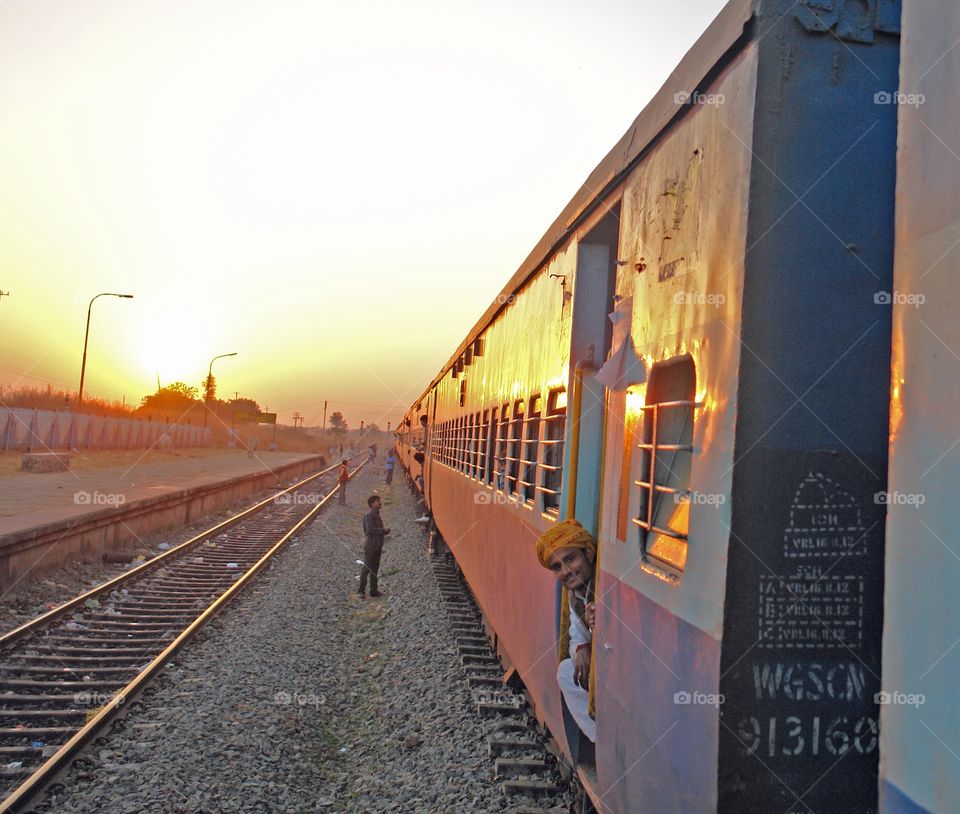 Varanasi to Mumbai by train . Man smiles as he sees me taking his picture 