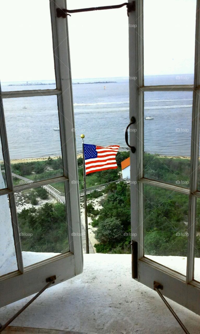 American Flag. top of the Fire Island light house