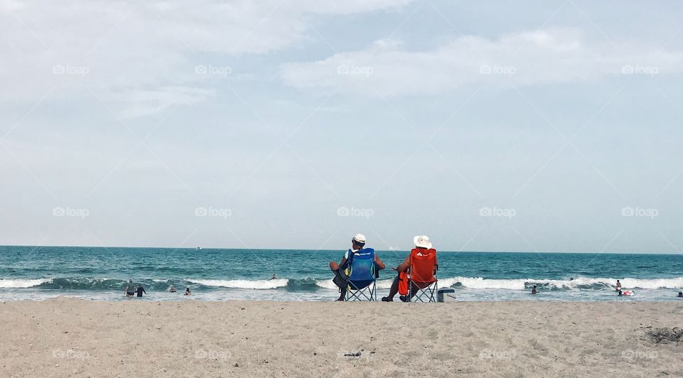 We could stay here forever, just you and me. Sitting by the ocean, soaking up the sea. 