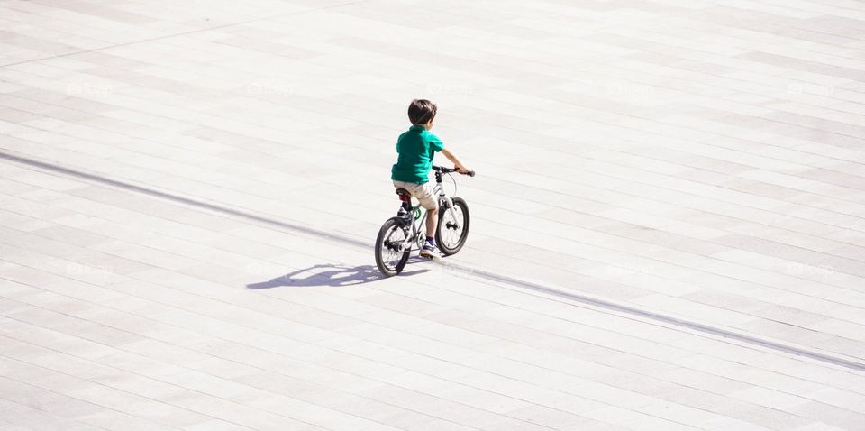 Little boy is riding the bicycle 