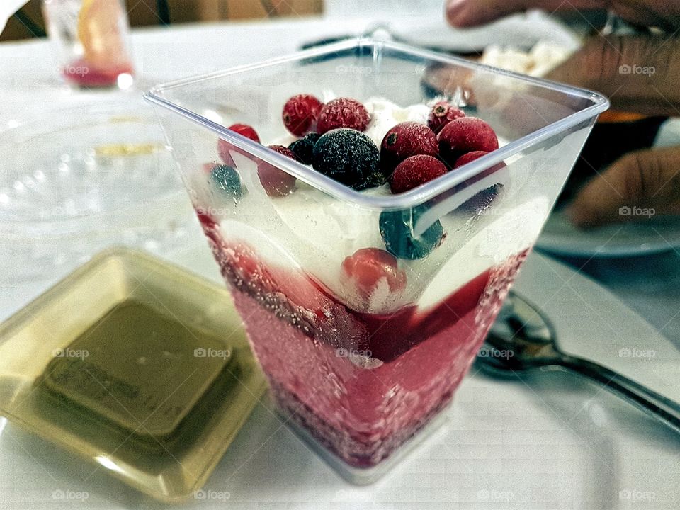 Dessert cheese ice cream with raspberry sorbet and berries