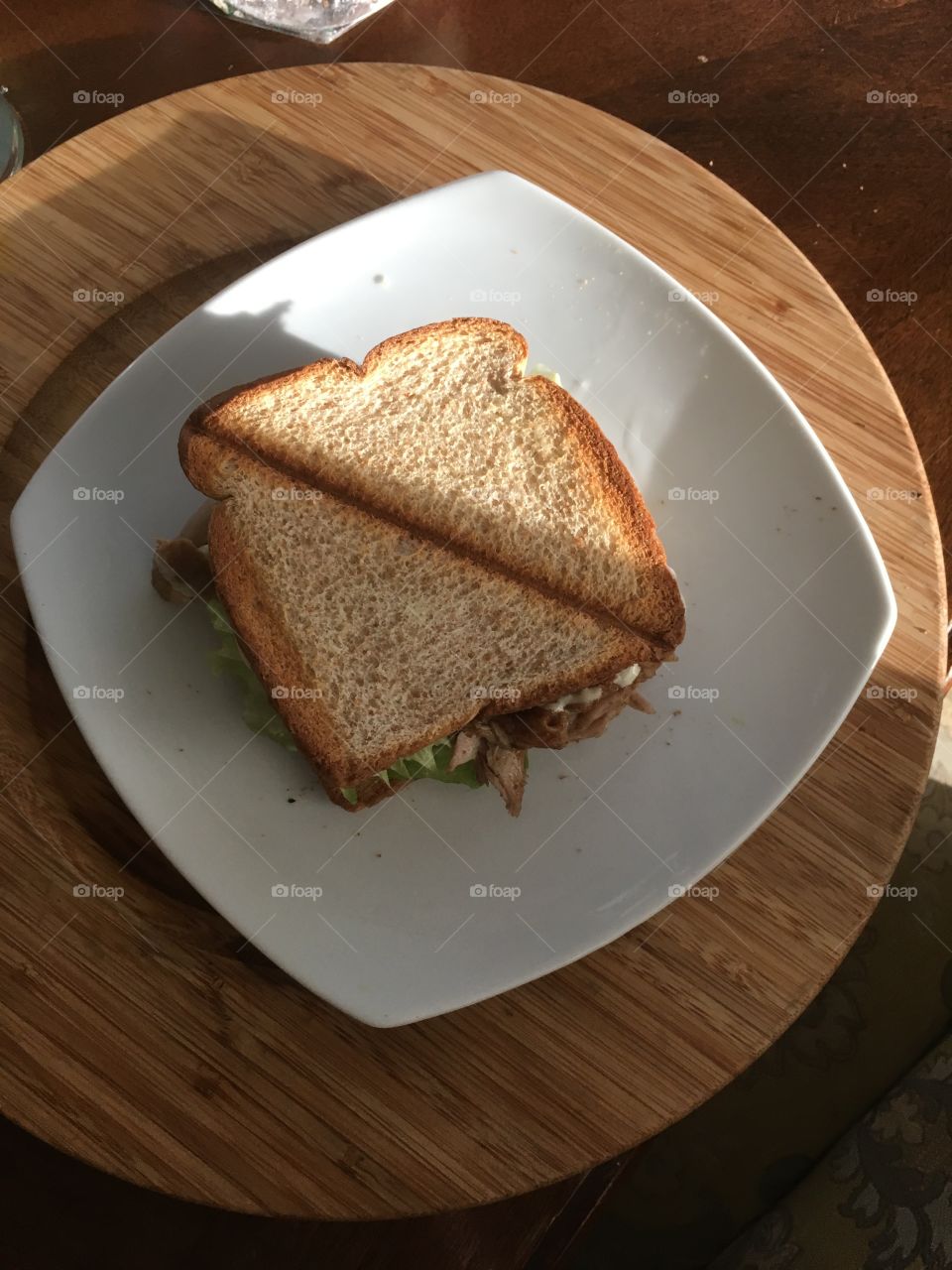A spicy scrumptious chicken sandwich. From a top angle 