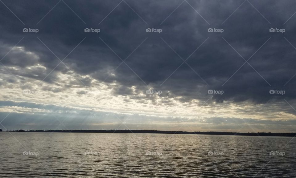 a storm is coming in over the lake