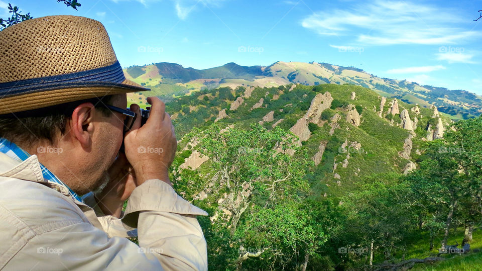 Photographer taking landscape photos on the back side of Mount Diablo, California. 