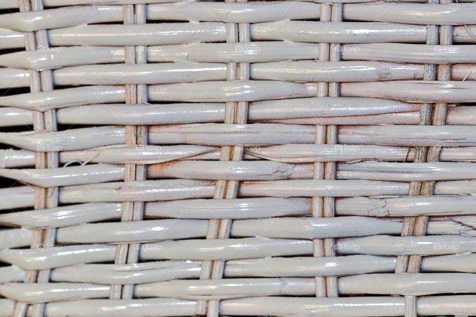 White wicker rattan basket weave closeup textural and pattern 