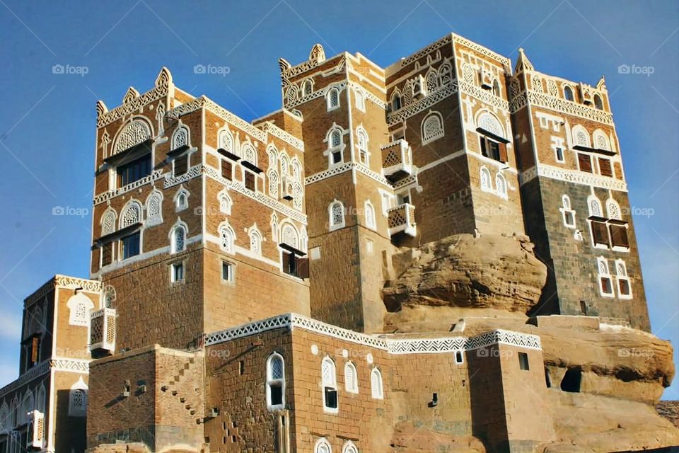 A stunning view of green mountains covered in fog in Yemen