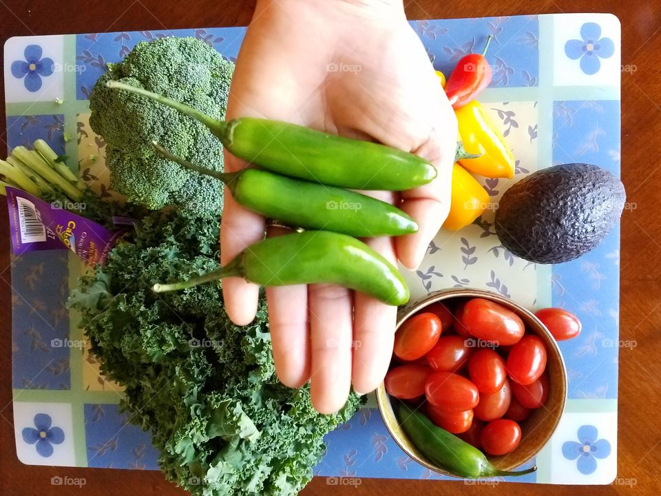 Holding Serrano chilli