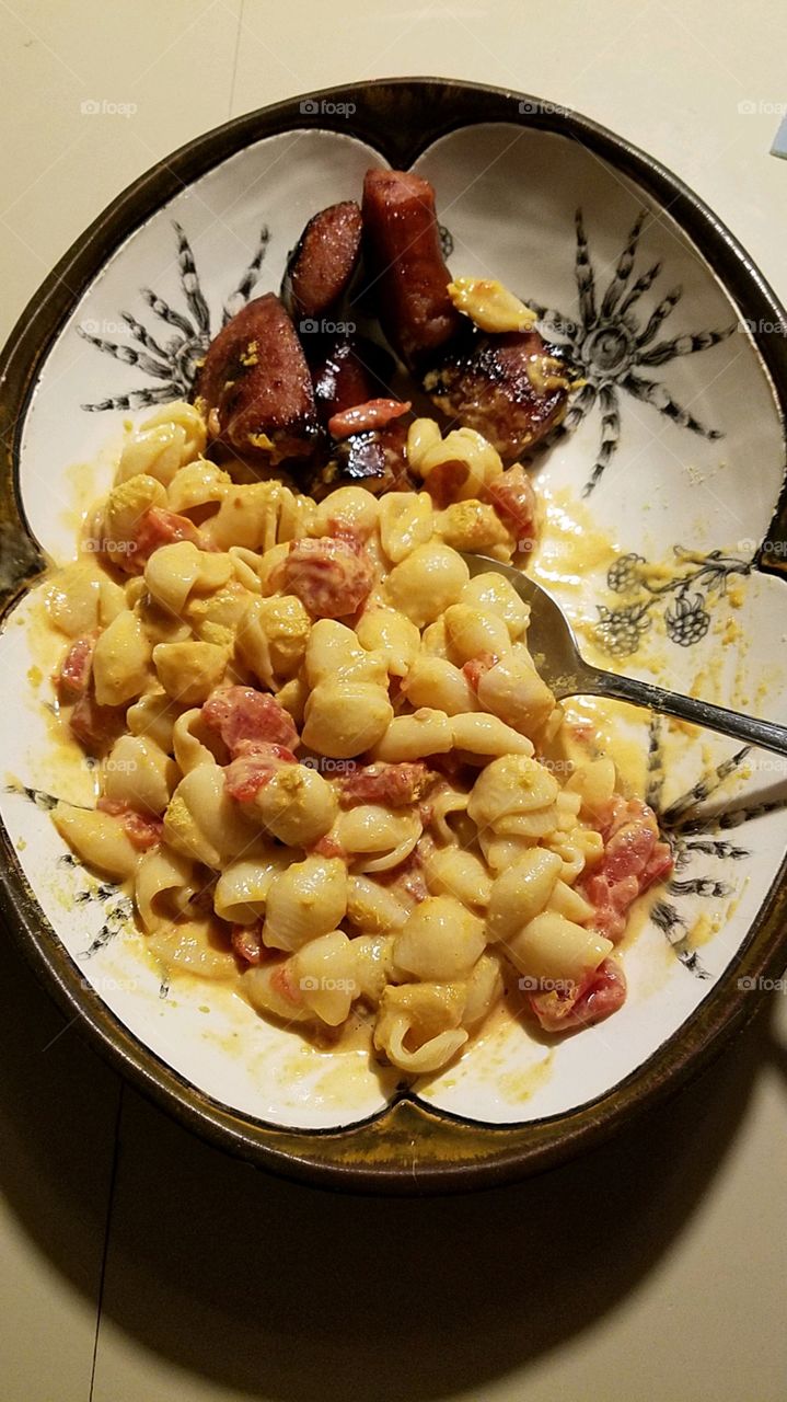 Macaroni and Cheese with kielbasa, served in bowl with spiders on it🕷