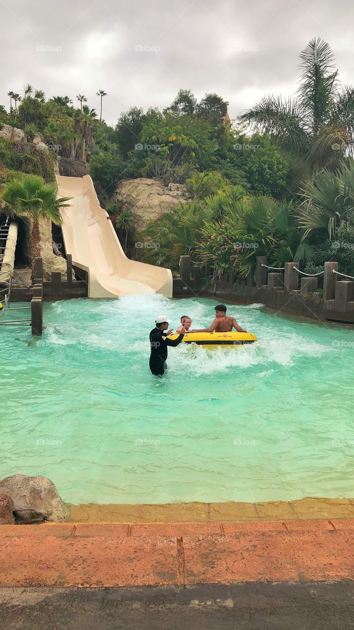 Splash down!  A little fun on a hot day the backdrop a tropical paradise what more could tou want.